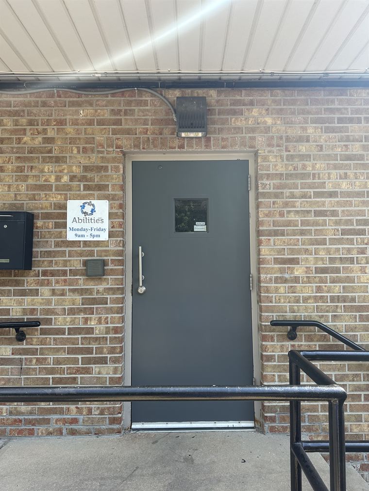 The same commercial door refinished with new hardware
